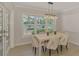 Dining room features a modern light fixture and a view of the water at 5377 Palos Verdes Dr, Sarasota, FL 34231