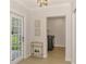 Bright entryway with views to laundry room and front yard at 5377 Palos Verdes Dr, Sarasota, FL 34231