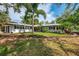 Charming exterior of home with lush landscaping and waterfront views at 5377 Palos Verdes Dr, Sarasota, FL 34231