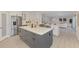 Bright, spacious kitchen with stainless appliances, a center island, open layout, and seamless transition to living area at 5377 Palos Verdes Dr, Sarasota, FL 34231