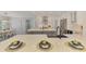 Modern kitchen with stainless steel appliances, a large island with sink, and dining space with natural light at 5377 Palos Verdes Dr, Sarasota, FL 34231
