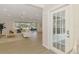 Bright, open living room with views of screened lanai and waterfront, and an abundance of natural light at 5377 Palos Verdes Dr, Sarasota, FL 34231