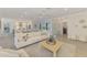 Stylish living room featuring tile flooring and an open floor plan, connecting to the kitchen and other living areas at 5377 Palos Verdes Dr, Sarasota, FL 34231