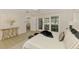 Cozy main bedroom with French doors providing water views and access to the rear of the property at 5377 Palos Verdes Dr, Sarasota, FL 34231