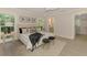 Serene main bedroom boasts natural light, stylish decor, and an en-suite bathroom for ultimate relaxation at 5377 Palos Verdes Dr, Sarasota, FL 34231