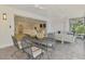 Inviting sunroom with comfortable seating, dining area, and seamless flow to indoor spaces at 5377 Palos Verdes Dr, Sarasota, FL 34231