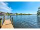 Private dock on the waterway featuring a beautiful view of a luxury home at 5377 Palos Verdes Dr, Sarasota, FL 34231