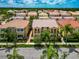 Lovely aerial view of a palm-lined neighborhood showcasing stunning two-story homes at 5388 Davini St, Sarasota, FL 34238