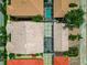 Overhead shot of tile roofs and screened enclosures with glimpses of the pool at 5388 Davini St, Sarasota, FL 34238