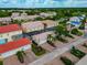 Wide aerial view of the community showcasing a variety of homes and lush landscaping at 5388 Davini St, Sarasota, FL 34238