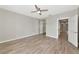 Bedroom featuring wood-style flooring and closet with mirrored doors at 5388 Davini St, Sarasota, FL 34238