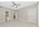 This is a bright bedroom with tile floors and an interior door at 5388 Davini St, Sarasota, FL 34238