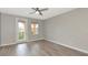 Bedroom features stylish ceiling fan, wood floors, and balcony access at 5388 Davini St, Sarasota, FL 34238
