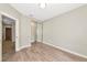 A bedroom with hardwood floors, sliding closet doors, and a closet at 5388 Davini St, Sarasota, FL 34238