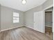 A bedroom with hardwood floors and a bright window at 5388 Davini St, Sarasota, FL 34238