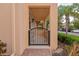 Quaint gated entrance of a residential property, featuring brick pavers and lush landscaping at 5388 Davini St, Sarasota, FL 34238