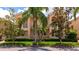 Delightful peach-colored townhome with manicured landscaping, a small balcony and tile roof at 5388 Davini St, Sarasota, FL 34238