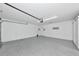Spacious two-car garage with epoxy flooring and ample storage space at 5388 Davini St, Sarasota, FL 34238