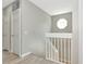 Hallway with staircase, two doors, and an octagonal window at 5388 Davini St, Sarasota, FL 34238