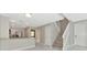 Inviting living room features stairs, kitchen view and great natural light at 5388 Davini St, Sarasota, FL 34238