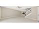 Expansive living room offers plenty of space, with light tile and stairs at 5388 Davini St, Sarasota, FL 34238