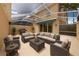Relaxing screened-in patio with comfortable seating, grill, and covered area perfect for entertaining at 5388 Davini St, Sarasota, FL 34238