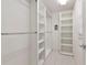 Spacious walk-in closet featuring custom shelving and ample storage space for organizing clothing and accessories at 5388 Davini St, Sarasota, FL 34238