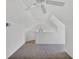 Neutral attic space with clean white paint and carpet throughout at 5531 Rosehill Rd # 204, Sarasota, FL 34233