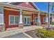 Inviting clubhouse entrance with stone accents and well-maintained landscaping at 5531 Rosehill Rd # 204, Sarasota, FL 34233