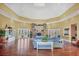 Spacious common area with wood floors, a fireplace, and comfortable seating at 5531 Rosehill Rd # 204, Sarasota, FL 34233