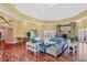 Bright common area with a stone fireplace, hardwood floors, and comfortable seating at 5531 Rosehill Rd # 204, Sarasota, FL 34233