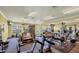 Well-equipped gym with treadmills, weight machines, and ample natural light at 5531 Rosehill Rd # 204, Sarasota, FL 34233