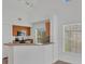 Bright kitchen with breakfast bar, natural wood cabinets, and plenty of natural light at 5531 Rosehill Rd # 204, Sarasota, FL 34233
