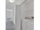 Convenient laundry room featuring a washer, dryer, and extra storage space at 5531 Rosehill Rd # 204, Sarasota, FL 34233