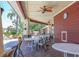 Covered patio with multiple tables and ceiling fans at 5531 Rosehill Rd # 204, Sarasota, FL 34233