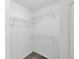 Walk-in closet with built in shelving at 5531 Rosehill Rd # 204, Sarasota, FL 34233