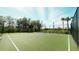 Community basketball court surrounded by trees and landscaping at 5684 Blue Reef Place, Nokomis, FL 34275