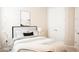 The bedroom has soft carpet, neutral colors, an accent wall decoration and a plush bed for comfort at 5684 Blue Reef Place, Nokomis, FL 34275