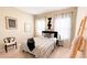 This bedroom is decorated with an artistic style and modern decor that includes a unique side table and bed frame at 5684 Blue Reef Place, Nokomis, FL 34275