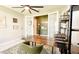 This home office is fully equipped with natural light, dual desks, modern furniture, and custom decor at 5684 Blue Reef Place, Nokomis, FL 34275