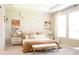 Serene bedroom with neutral tones, elegant furniture, and large windows for natural light at 5684 Blue Reef Place, Nokomis, FL 34275