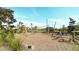 Community playground with wooden climbing structures and natural landscaping at 5684 Blue Reef Place, Nokomis, FL 34275