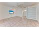 Inviting living area featuring tile floors, built-in shelves, and modern amenities at 585 Khyber Ln, Venice, FL 34293