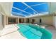 Sparkling pool and spa combo with screened lanai for ultimate relaxation and outdoor living at 585 Khyber Ln, Venice, FL 34293