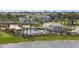 Gorgeous community pool with plenty of lounge chairs, palm trees, and a covered pavilion at 5885 Biscotti St, Nokomis, FL 34275