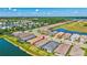 Community aerial showcasing residential streets, lush landscaping, lakes, and beautiful single-Gathering homes at 6203 Grandview Hill Ct, Bradenton, FL 34203