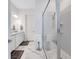 Bright bathroom featuring double sinks, a sleek glass shower, and elegant marble flooring at 6203 Grandview Hill Ct, Bradenton, FL 34203