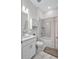 Clean bathroom featuring a shower, toilet, and sink with cabinet space at 6203 Grandview Hill Ct, Bradenton, FL 34203