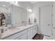 Bright bathroom featuring double sinks, a sleek glass shower, and elegant marble flooring at 6203 Grandview Hill Ct, Bradenton, FL 34203