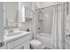 Clean bathroom featuring a shower, toilet, and sink with cabinet space at 6203 Grandview Hill Ct, Bradenton, FL 34203